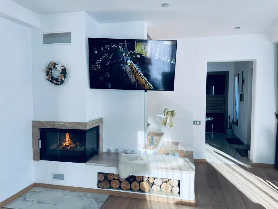 Christmas fireplace with decorative wreath and tree